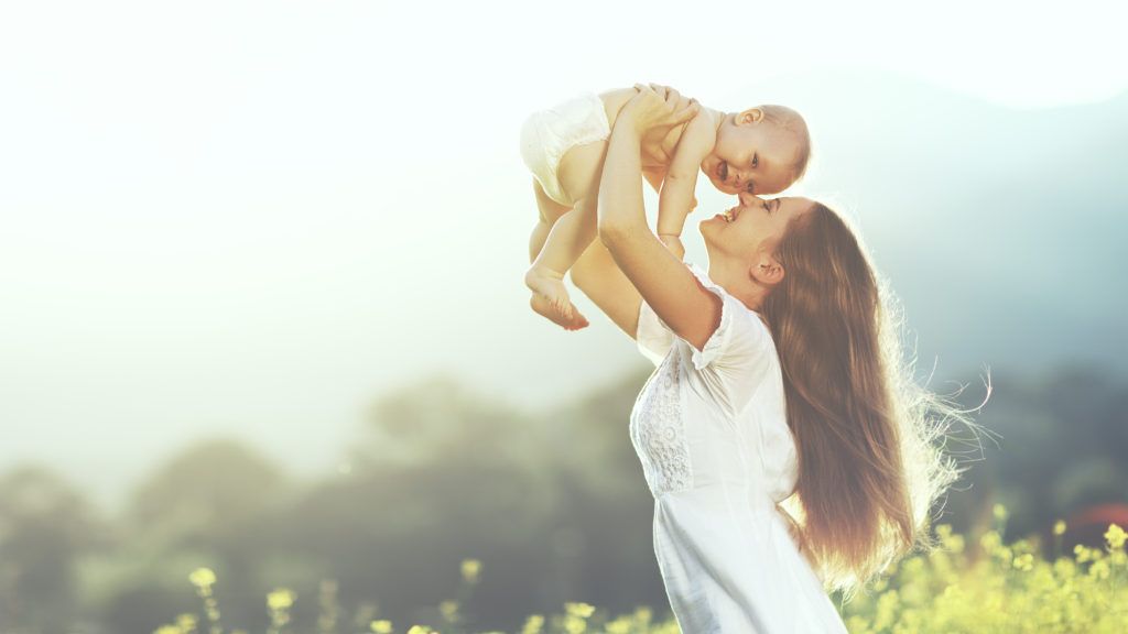 Mother Lifting Baby to the Sky