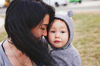 Woman Holding Child