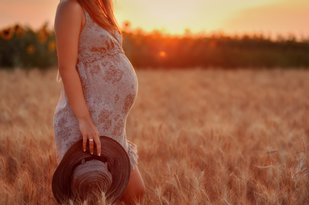 Pregnant Woman in Wheat Field