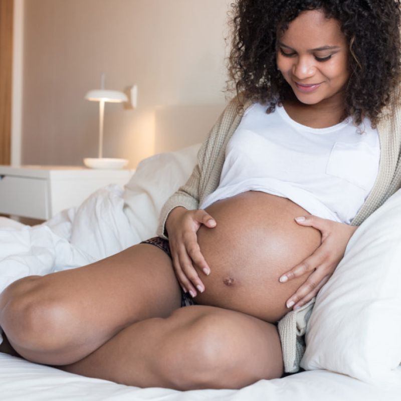 Pregnant Woman Holding Stomach