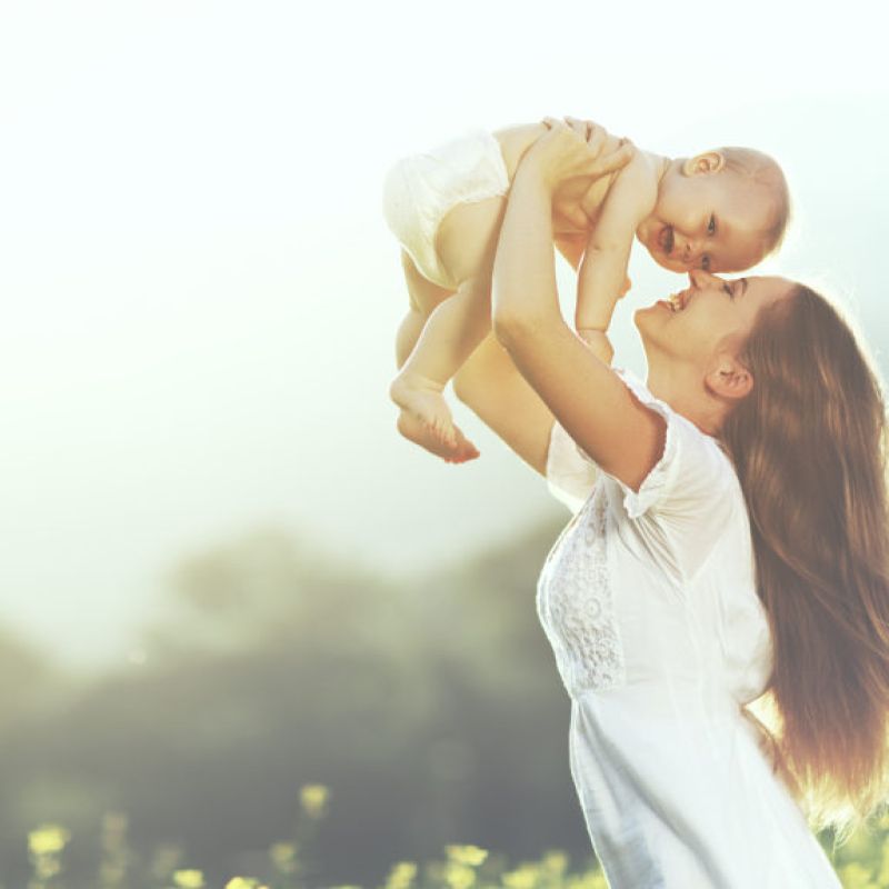 Mother Lifting Baby to the Sky